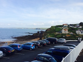 The hotel car park, perched on the cliff above the cove